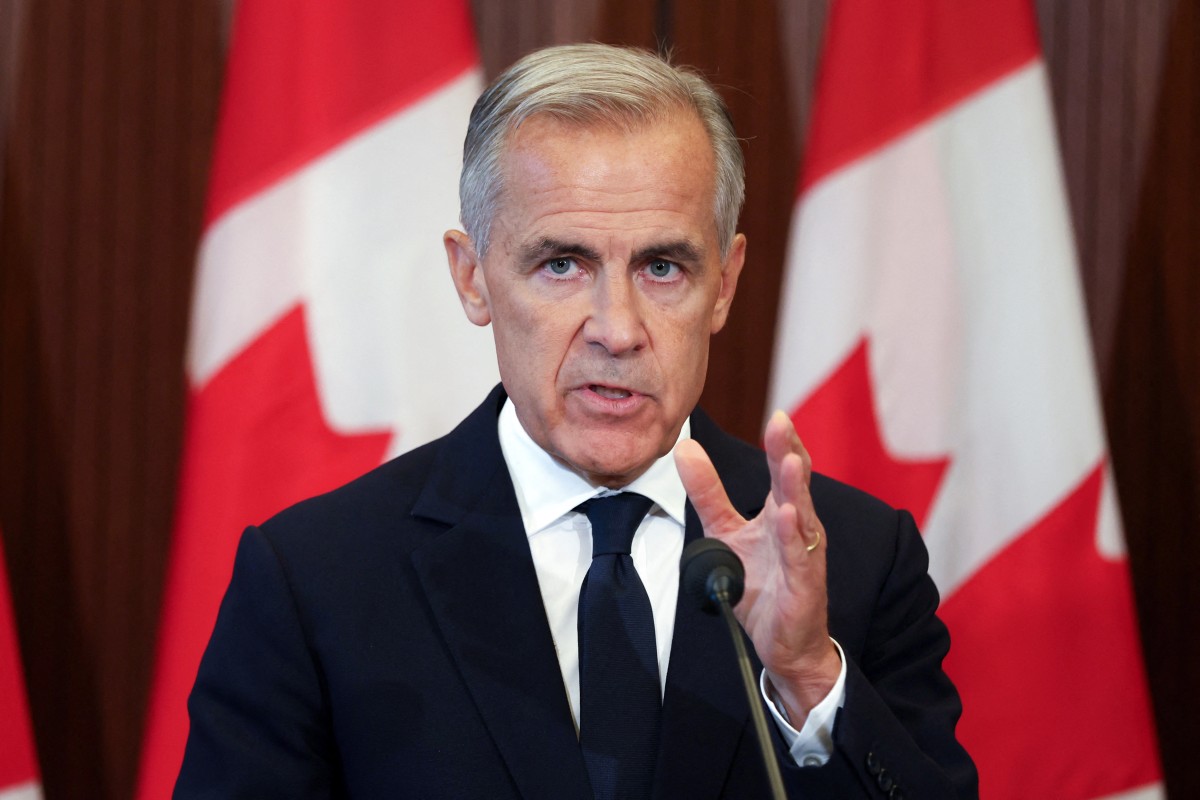 Thủ tướng Canada Mark Carney phát biểu tại cuộc họp báo ở Ottawa vào ngày 22-8-2026, sau khi các cuộc đàm phán thương mại với Mỹ đổ vỡ - Ảnh: AFP